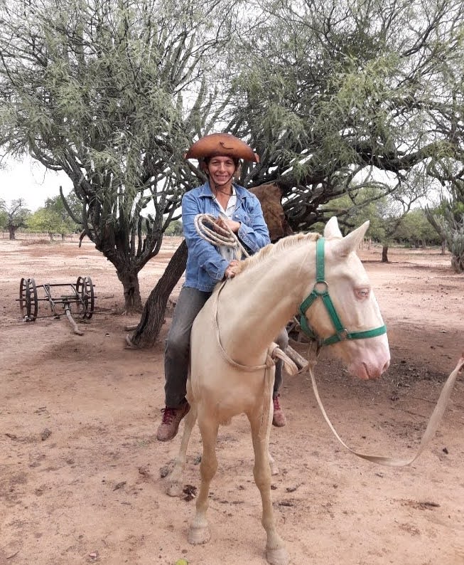 Lucía riding a horse