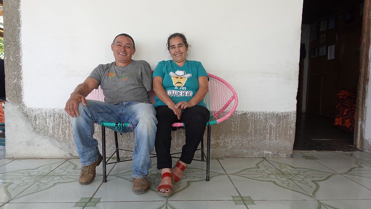 Elda Patricia Rodríguez, coffee smallholder and Panchito's wife, works drying coffee