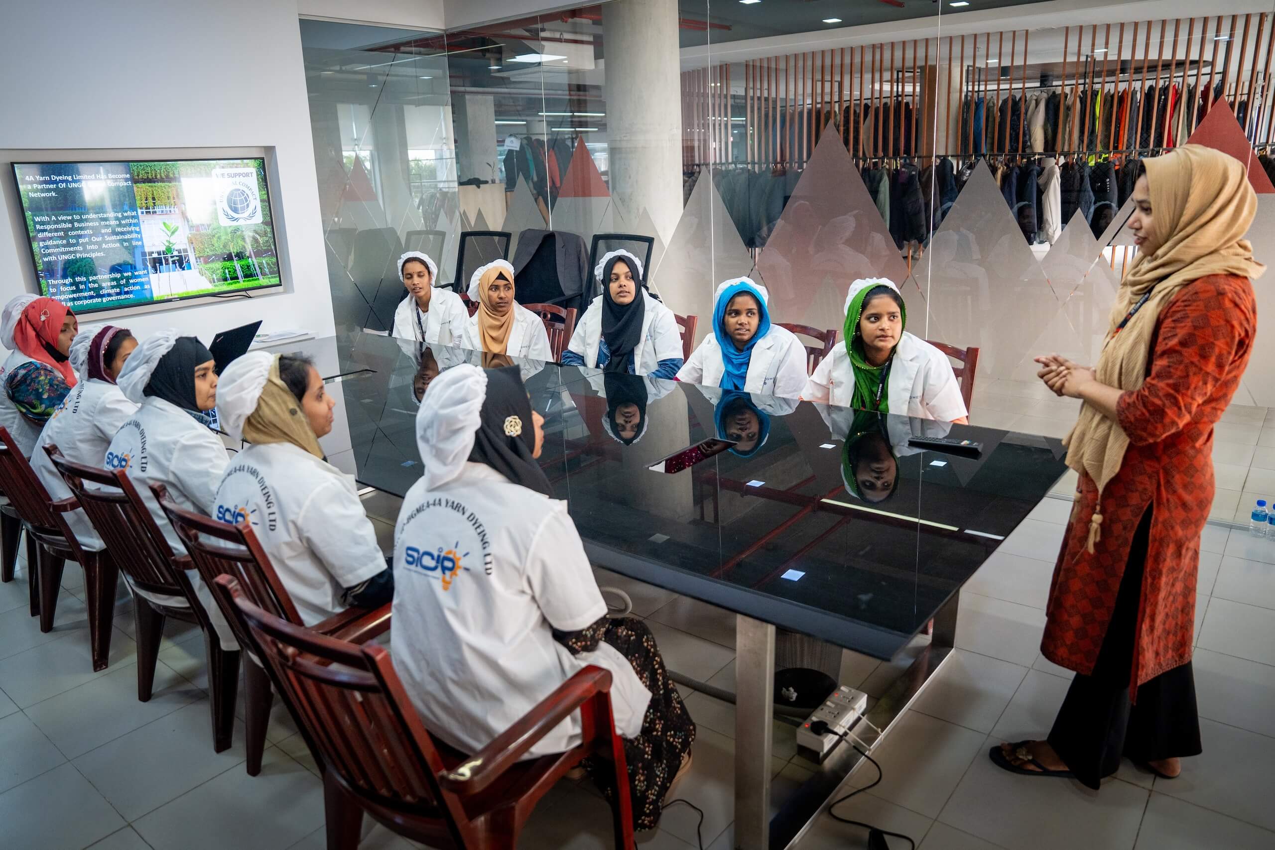 Textile workers meeting around a table