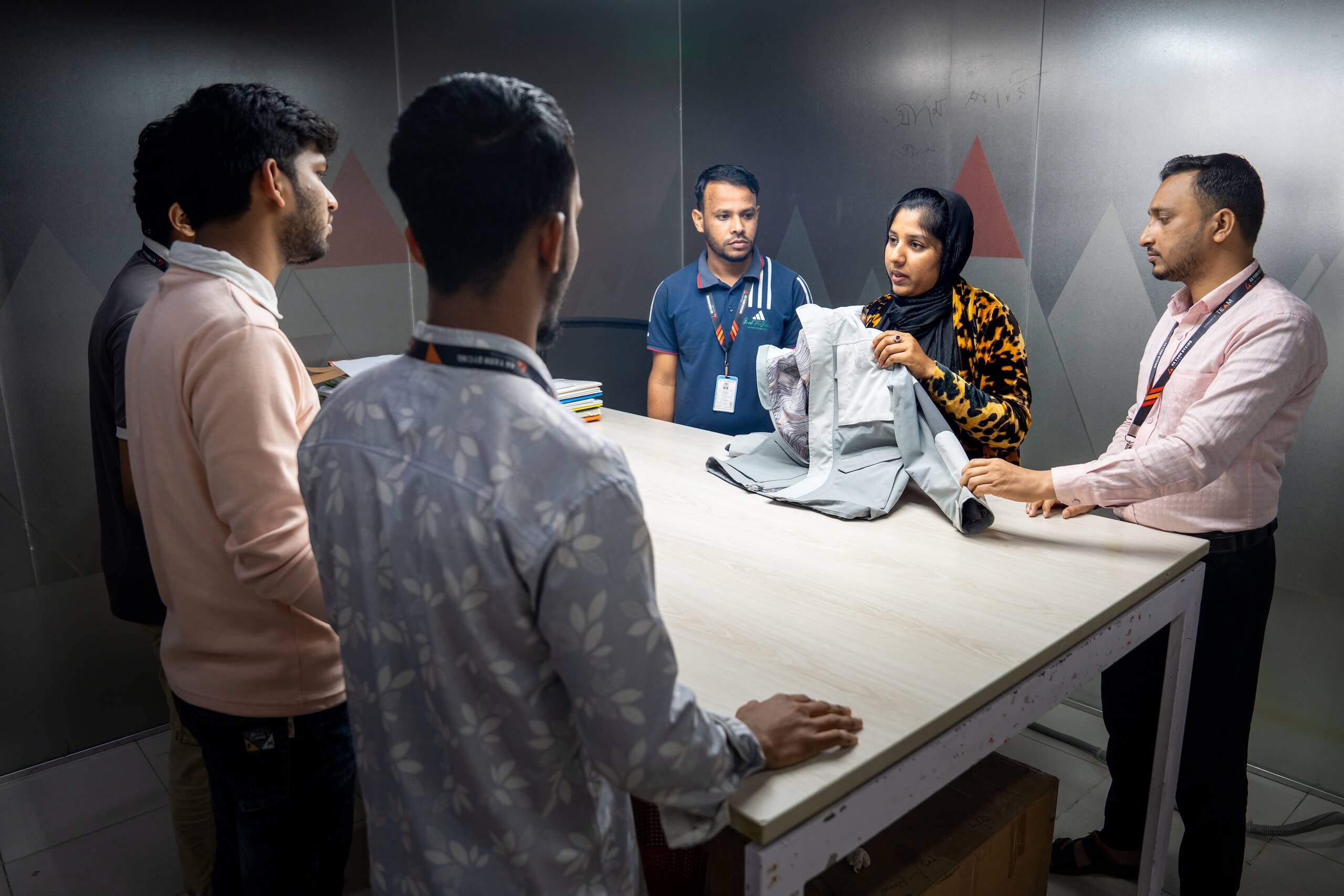 Group of people discussing textiles