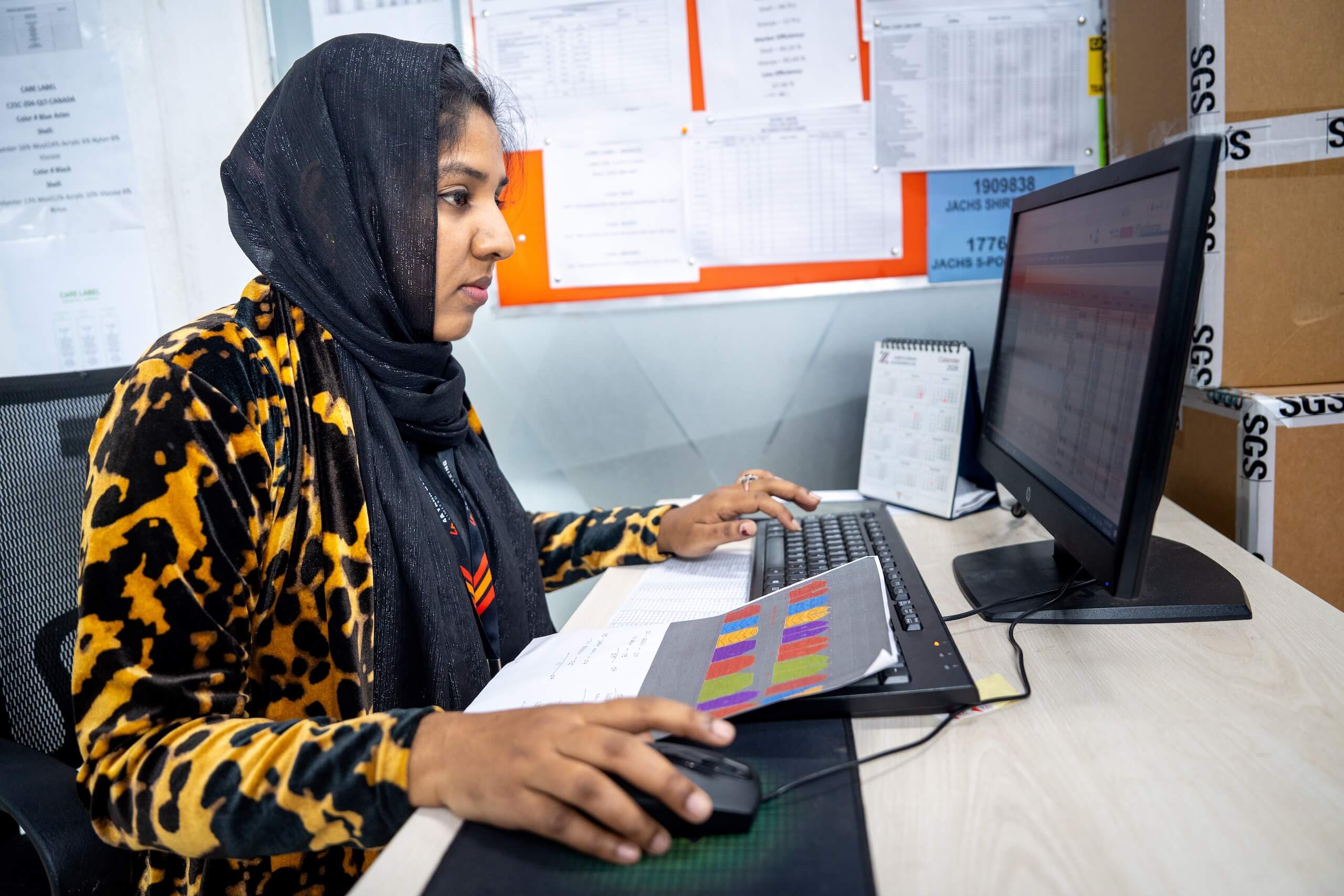 Eva Moni working on a computer